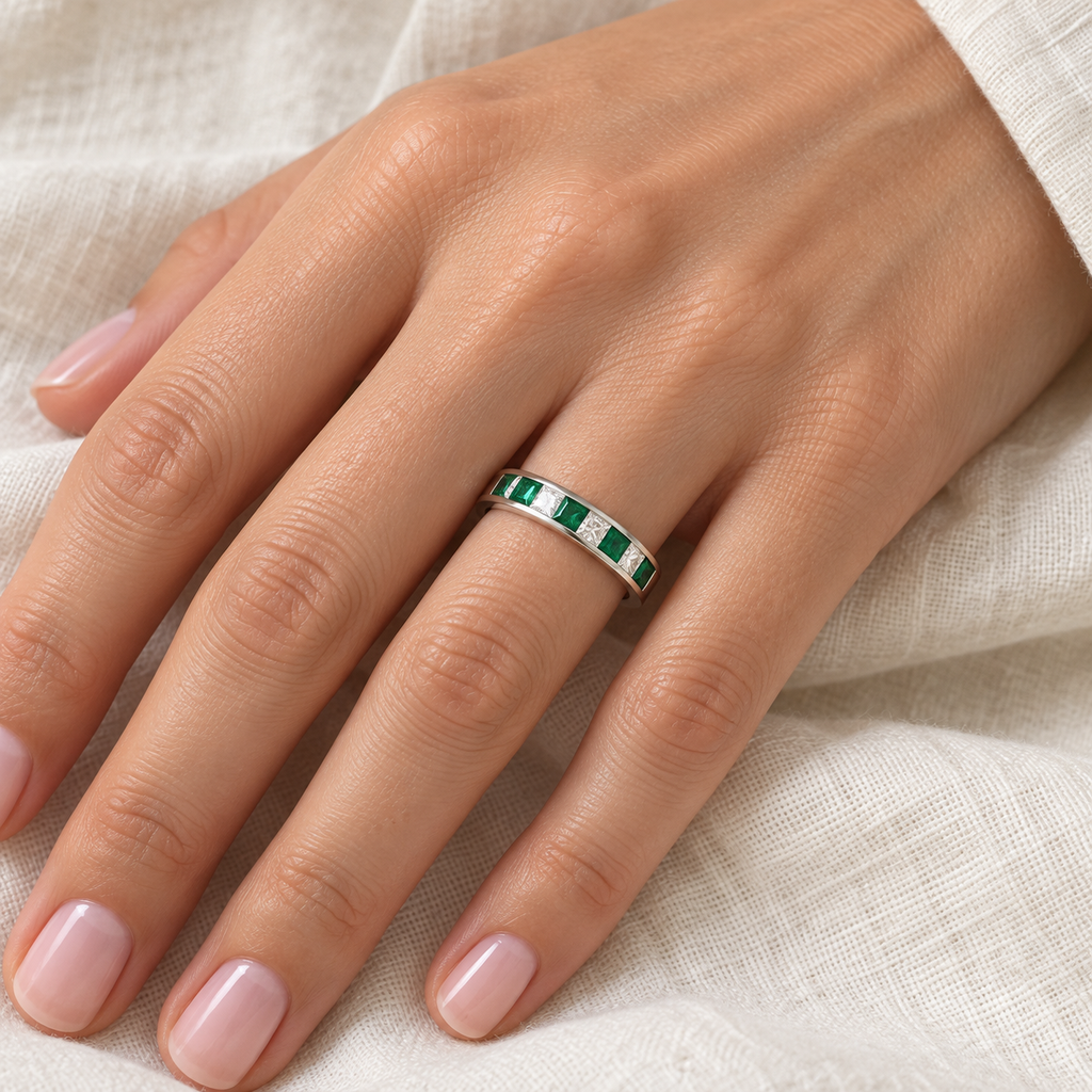 Five princess-cut lab emeralds and four lab-grown diamonds in 14K white gold channel-set band,4mm,0.73ctw — ivory-linen left-hand closeup