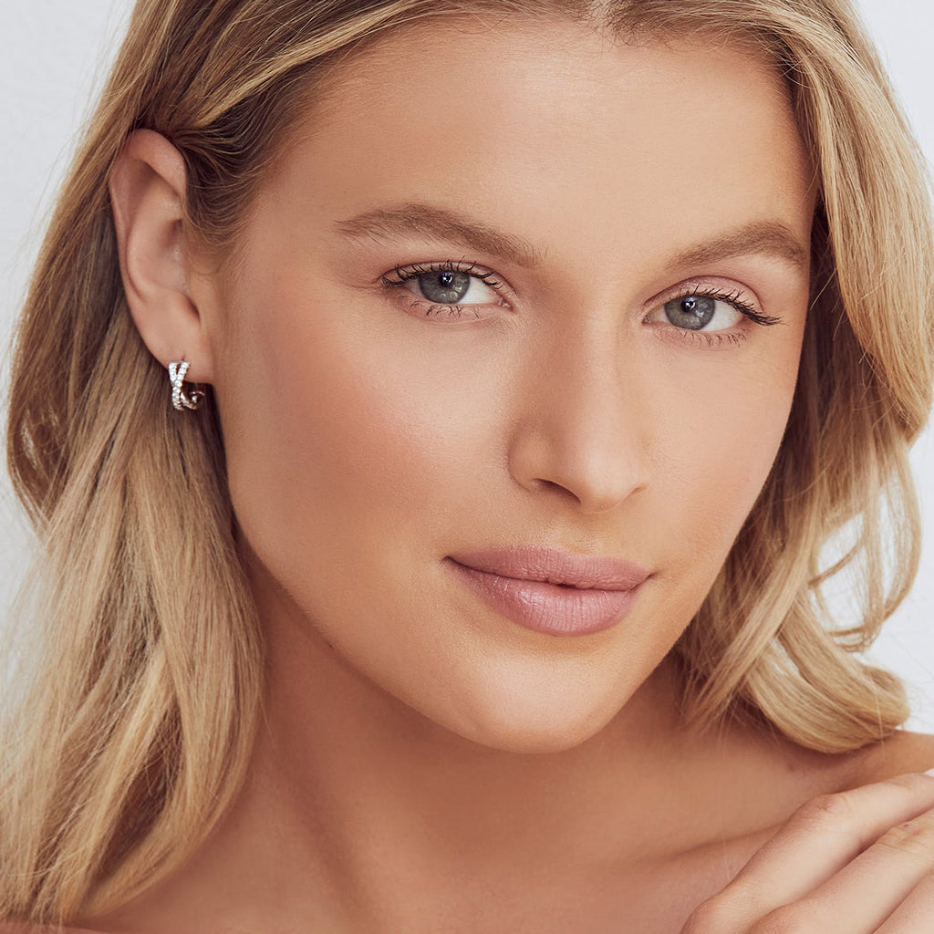 Diamond Accented Twisted X Huggie Earrings 14k White Gold (0.40ct)