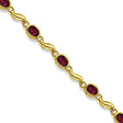 Bezel-Set Oval Garnet Bracelet in 14K Yellow Gold (7x5 mm)