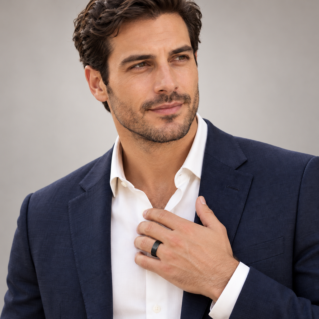 Male model wearing 8mm flat black tungsten wedding band in studio