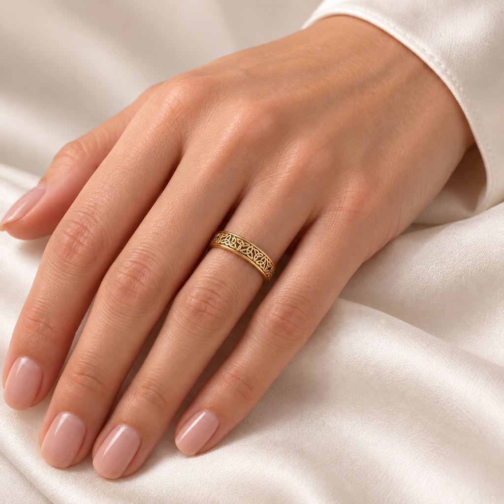 Celtic Knot Infinity Wedding Band Ring 14K Yellow Gold — female hand wearing wedding band