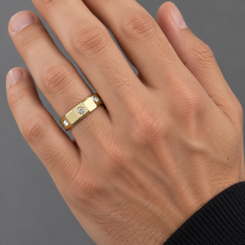 7.2mm 14K yellow gold faceted wedding band with three round diamonds — male hand
