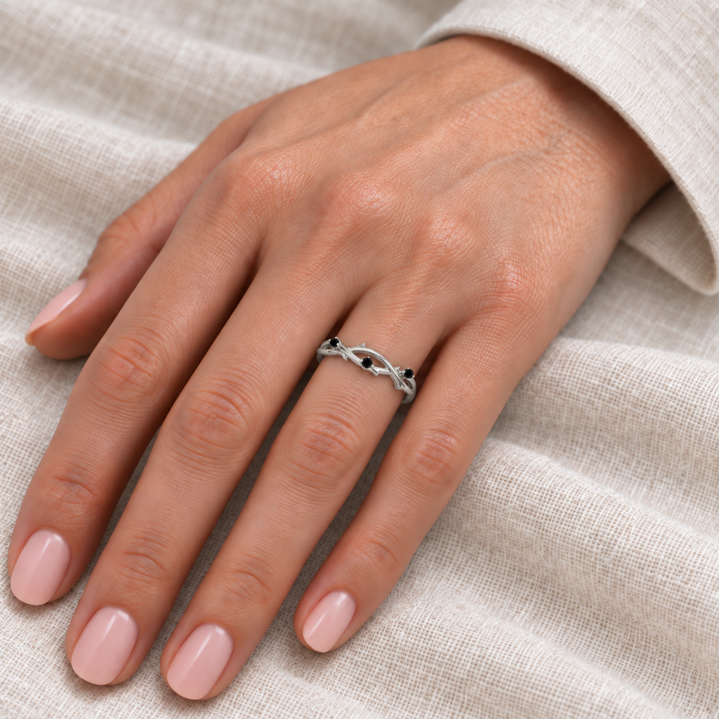 Black diamond vine leaf wedding band in palladium — hand view