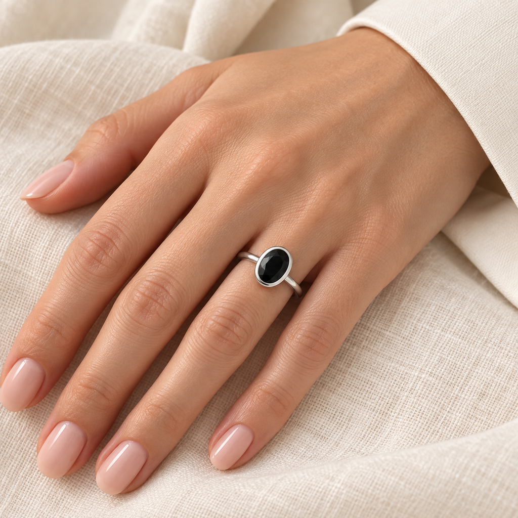 Oval Natural Black Diamond Bezel Engagement Ring in Platinum (1.25ct) – hand closeup