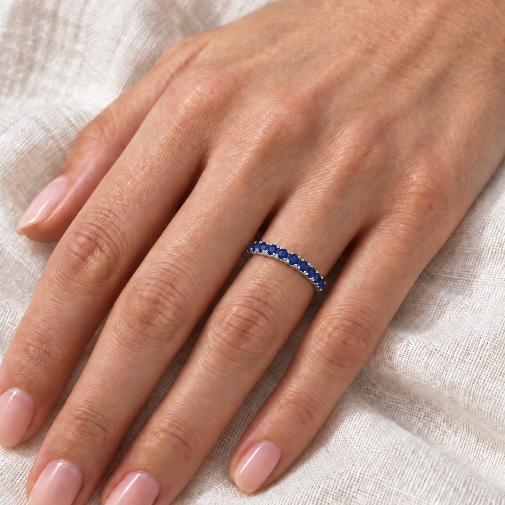 Blue Sapphire Stackable Ring Anniversary Band in Palladium (0.37ct) — close-up on ivory linen
