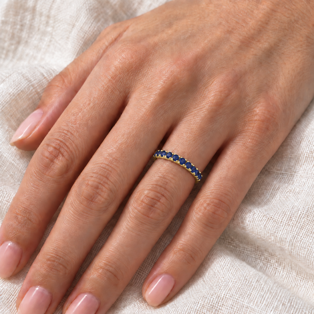 Lab Blue Sapphire Stackable Ring Anniversary Band in 14k Yellow Gold (0.37ct) — close-up on ivory linen