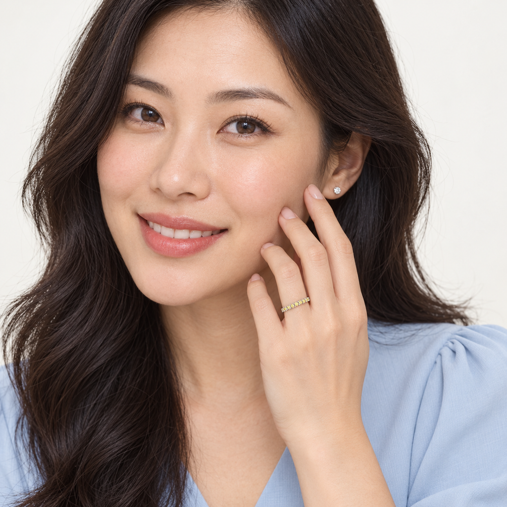 Model wearing yellow canary diamond white gold ring in studio