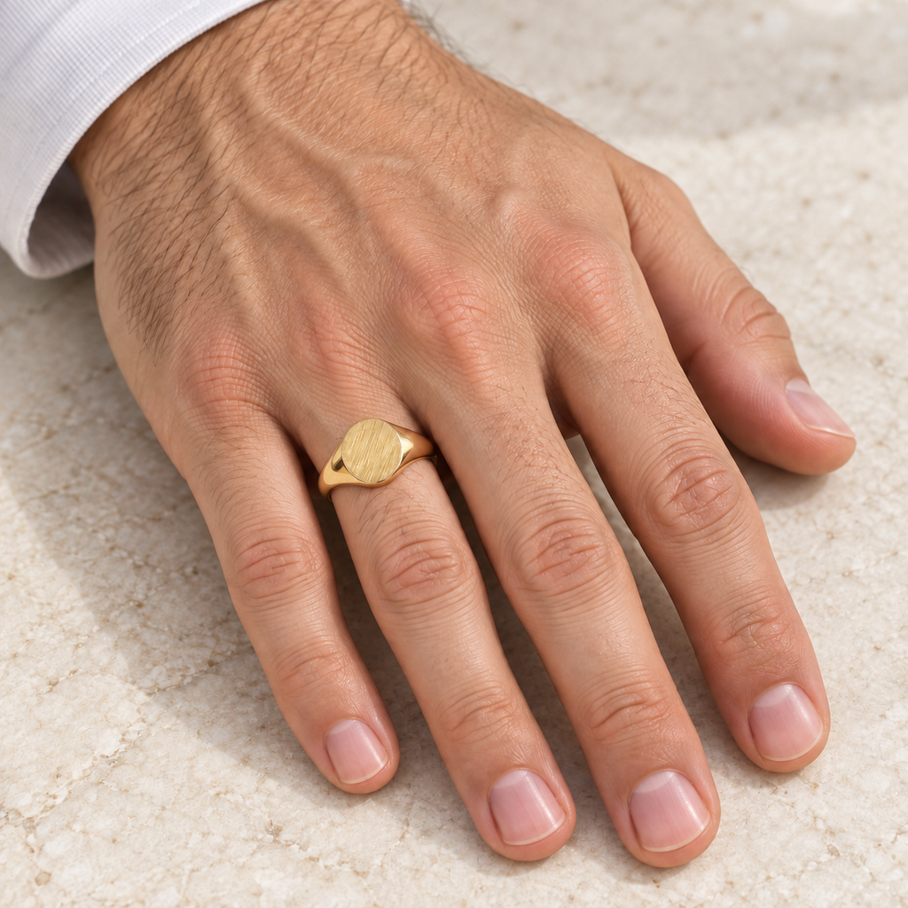 Men's Oval Shaped Signet Ring Engravable 14k Yellow Gold 10x8mm - Male hand wearing 10x8mm oval signet ring