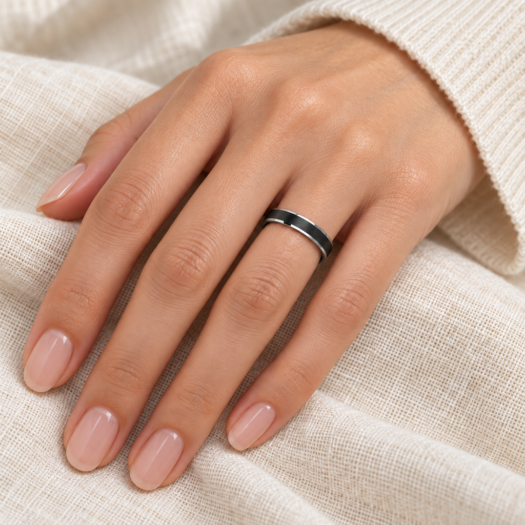 Beveled Edge with Black Brushed Carbide Tungsten Wedding Band (4mm) — Female hand wearing correctly scaled 4mm band