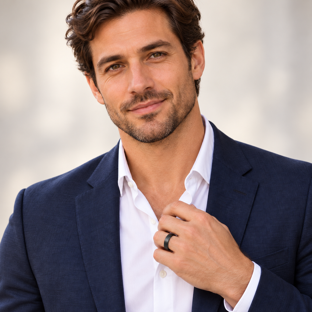 Male portrait wearing 6mm brushed black tungsten wedding band in studio
