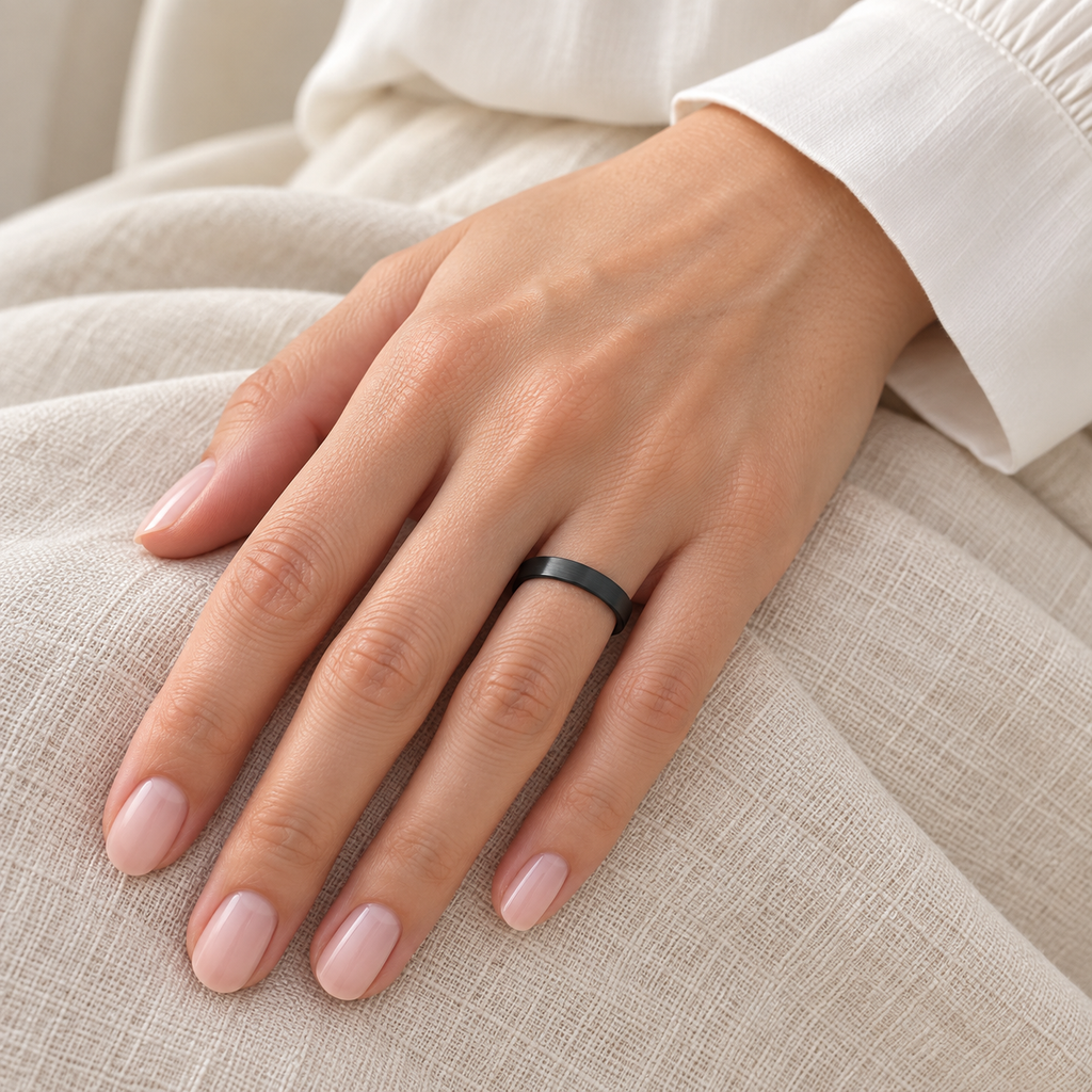 Brushed Finish Flat Carbide Black Tungsten Wedding Band (4mm) — female hand wearing wedding band