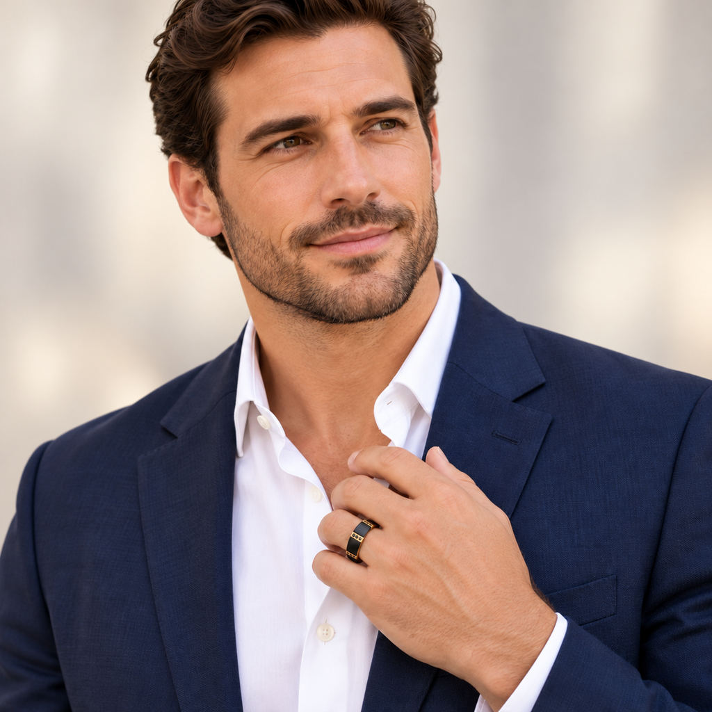 Male portrait wearing 8mm black diamond and gold bezel tungsten wedding band in studio