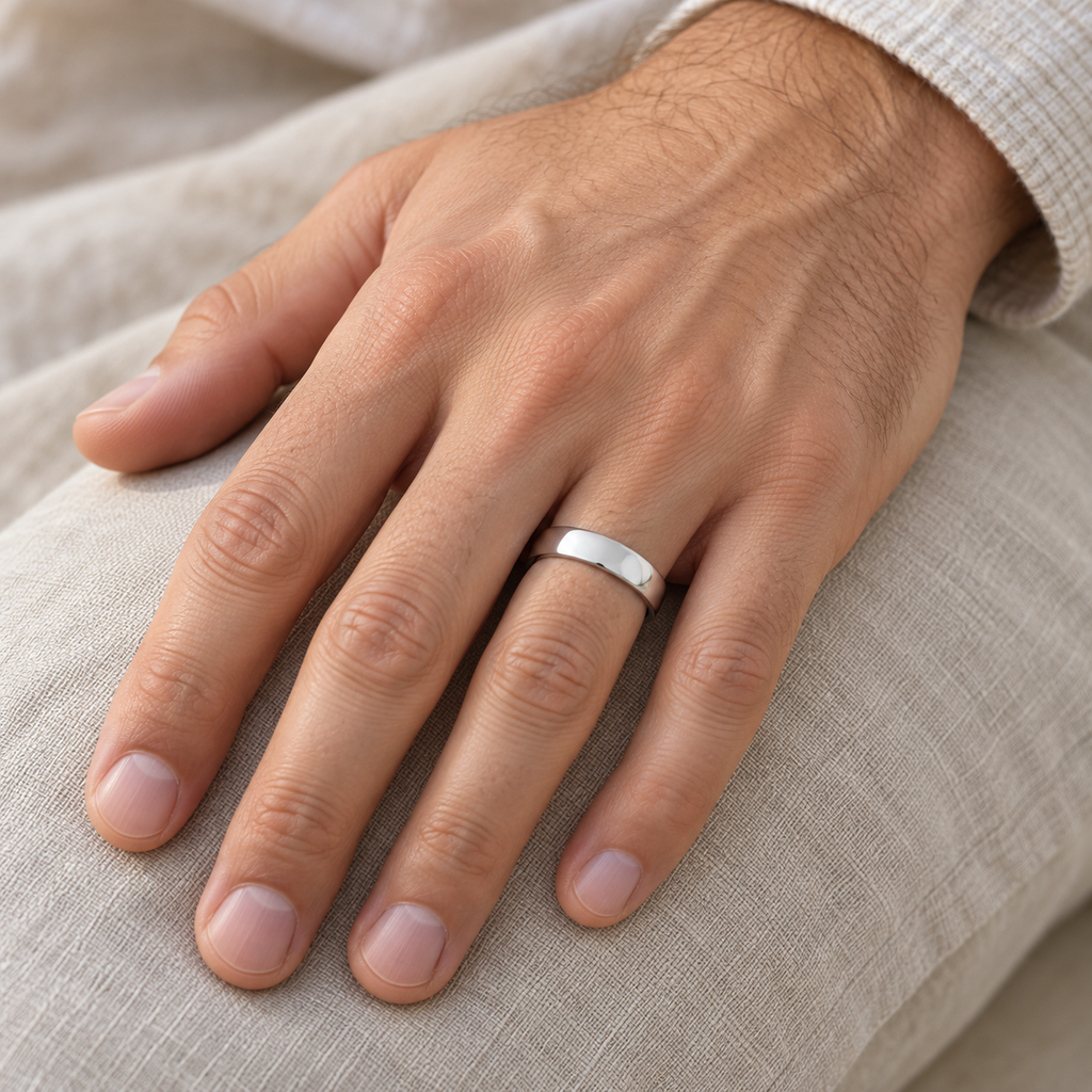 Palladium Wedding Ring Low Dome Comfort Fit (4 mm) — male hand wearing wedding band