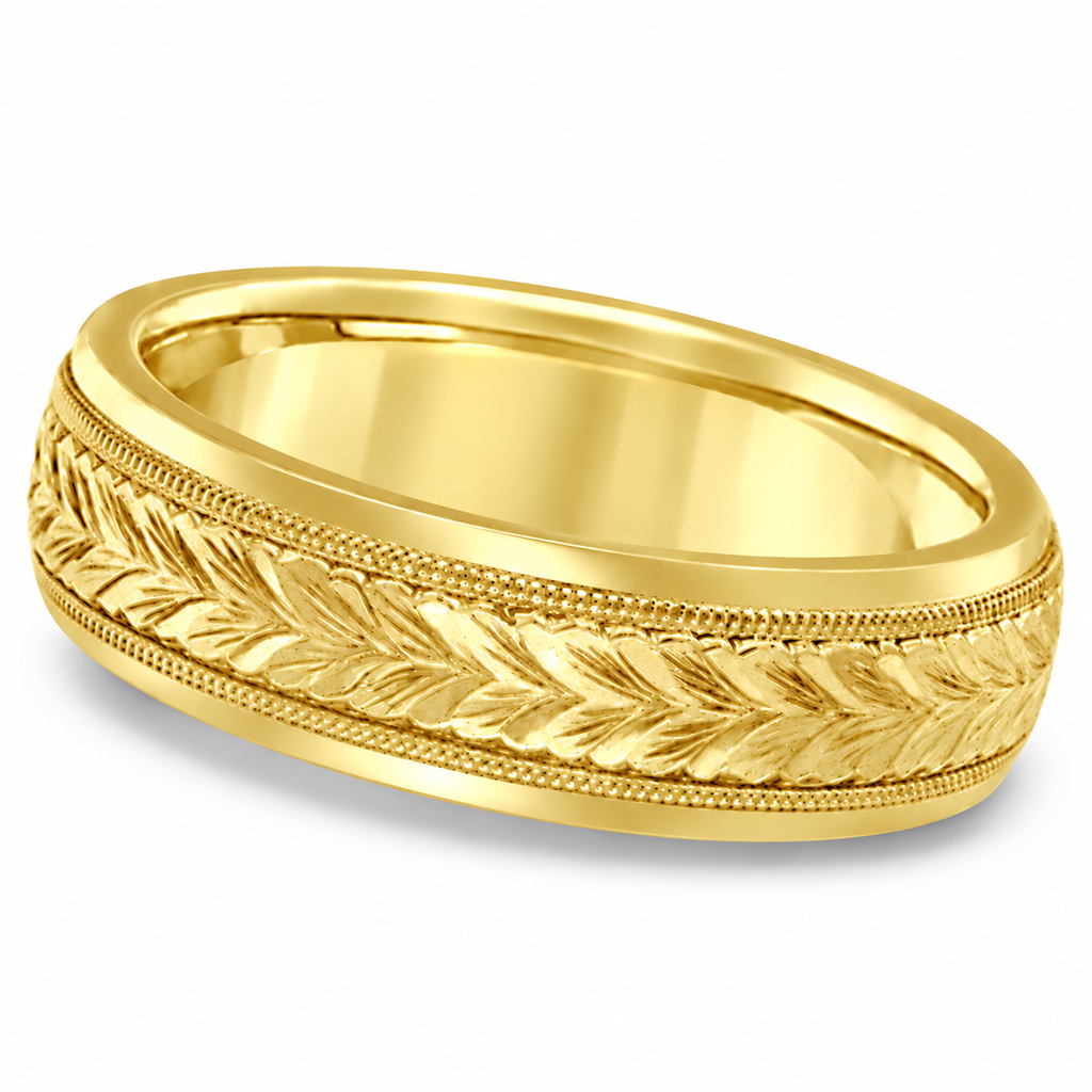 4.5mm 18k yellow gold hand-engraved leaf wedding band, gently angled hero with natural shadow
