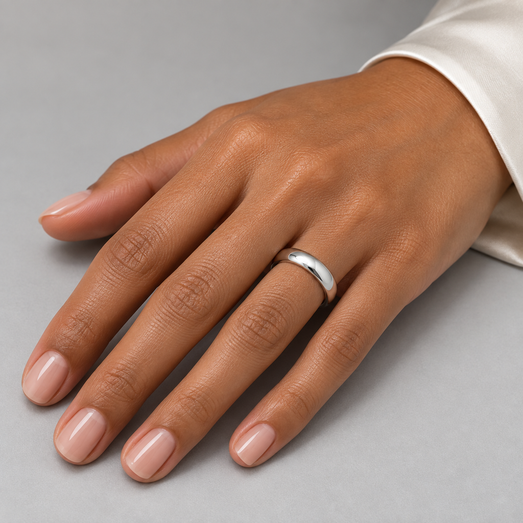 Dome Comfort Fit Wedding Ring Band Palladium (4mm) — female hand studio image