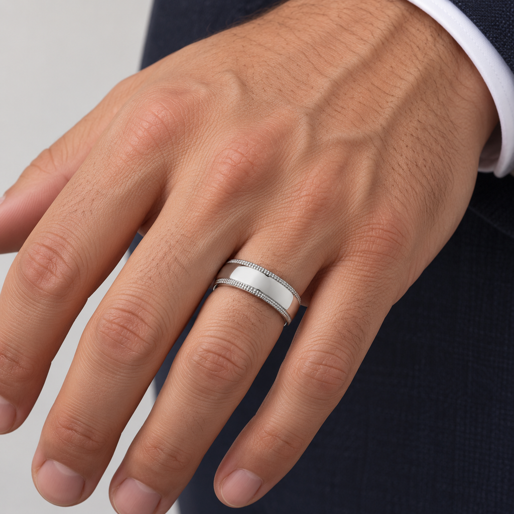 6 mm 950 palladium dome milgrain wedding band on a man's ring finger