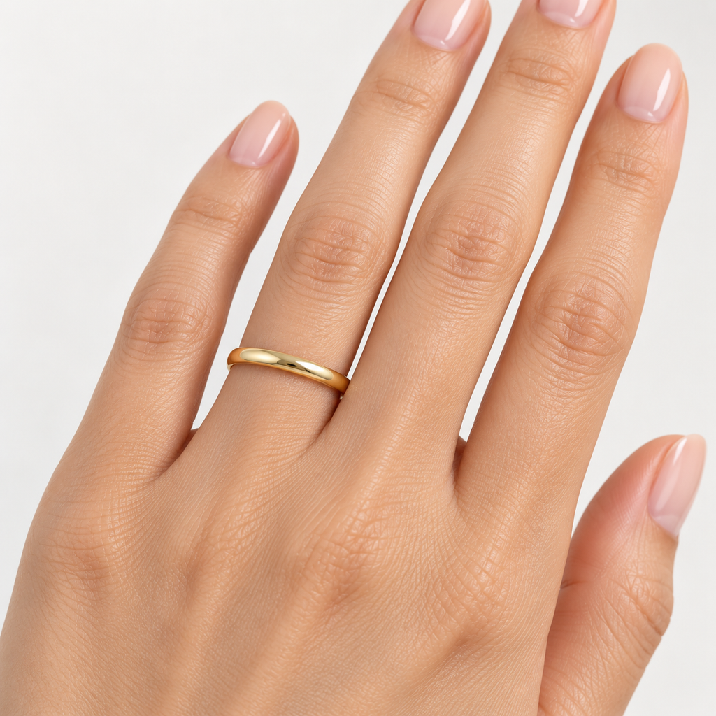 14k Yellow Gold Wedding Ring Low Dome Comfort Fit (2mm) — Female hand wearing 2mm wedding band
