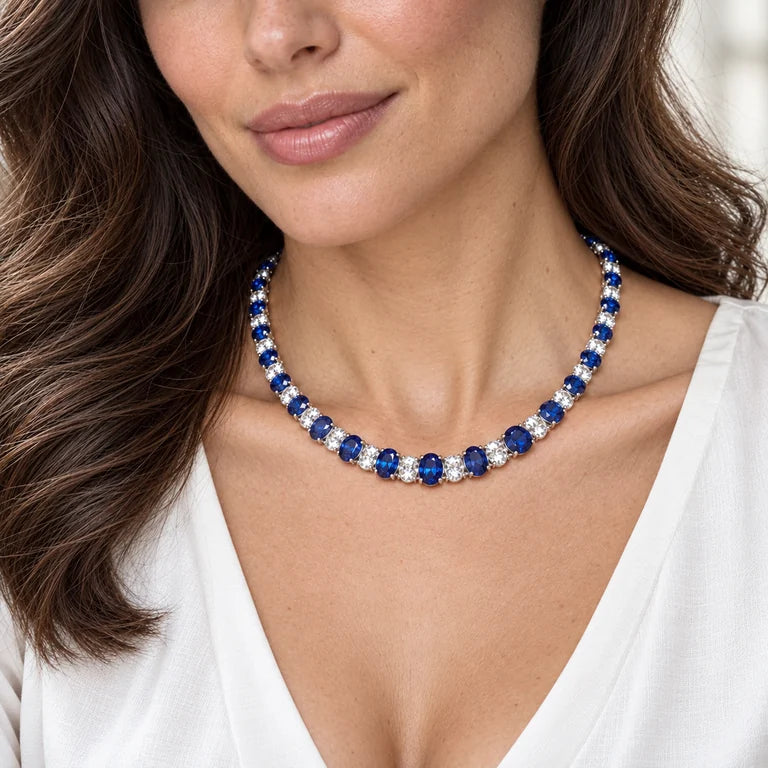 Model wearing a graduated sapphire and diamond necklace