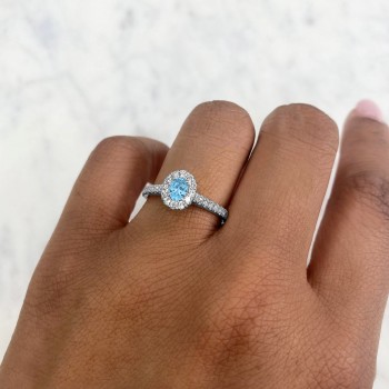 Oval Blue Topaz Solitaire & Diamond Engagement Ring 14K White Gold (0.62ct)